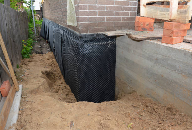 SJ Waterproofing Pros technician performing targeted Exterior Waterproofing assessment in Elizabeth, NJ